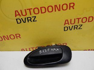 Ручка задніх лівих дверей зовнішня Mazda 323 1994 - 2000 4992294 фото